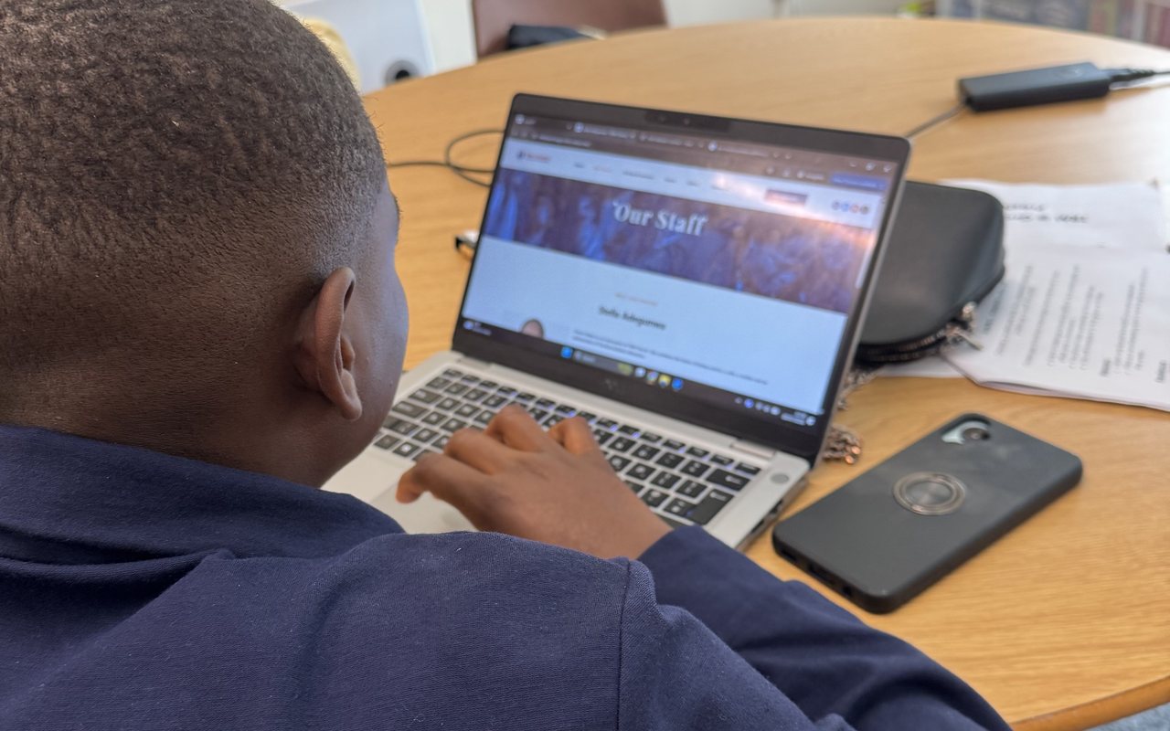A student building a website during a class